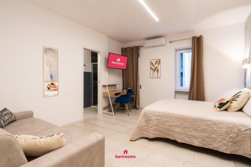 Postel nebo postele na pokoji v ubytování Barirooms - Murat Suites