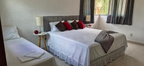 En eller flere senge i et værelse på Encanto da Lagoa