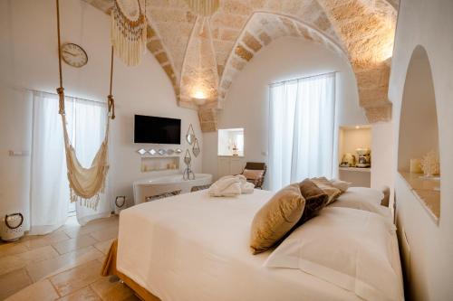 Postel nebo postele na pokoji v ubytování Apulia Charming Suites - Casa Rossa Suite Perla e Suite Corallo
