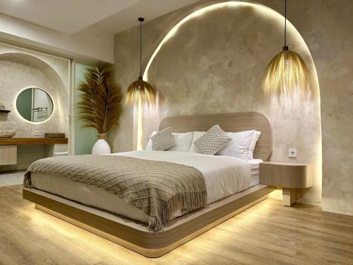ヌサドゥアにあるSpring Villa Nusa Duaのベッドルーム1室(大型ベッド1台、照明2つ付)
