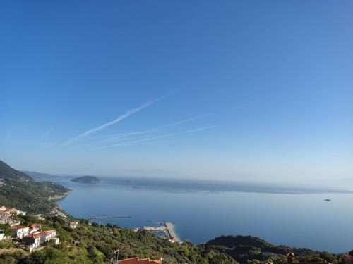 a view of a beach and a body of water at BlueSunnyParadise in Glóssa