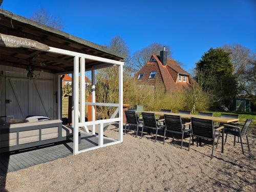 Foto sihtkohas Wittmund asuva majutusasutuse Smittshörn 3 - Nordsee Ferienhaus für Gruppen und Familien mit eingezäunten Garten galeriist