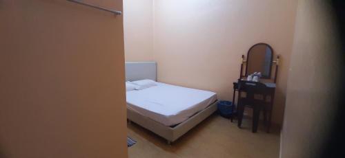 Postel nebo postele na pokoji v ubytování Wonderful Motel