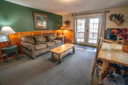 a living room with a couch and a coffee table at Lawn Lane A - #3382 in Estes Park