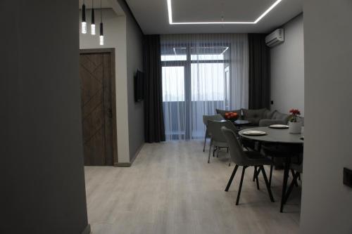 a dining room with a table and chairs at G Suite in Yerevan