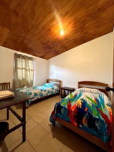 Postel nebo postele na pokoji v ubytování Rancho Colibrí