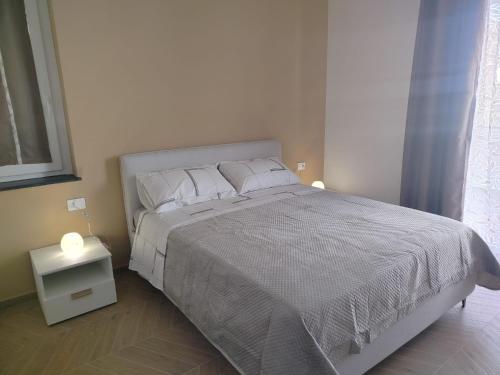 Postel nebo postele na pokoji v ubytování Grace Home
