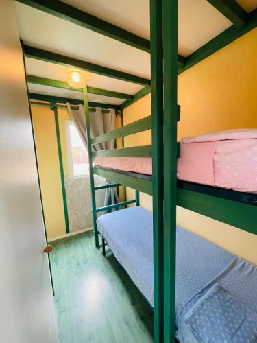 a couple of bunk beds in a room at Ti Maisonnette Plaine des Palmistes in La Plaine des Palmistes