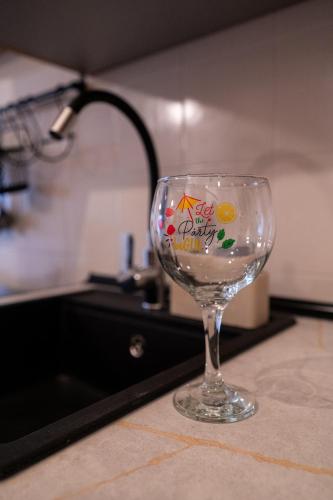 a wine glass with a sign on it sitting on a counter at Loft on the beach and a few steps from downtown in Torremolinos
