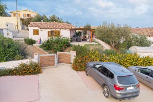 a car parked in front of a house at Villino Elisa in Tertenìa