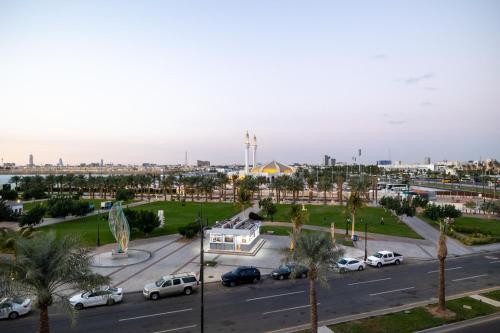 a view of a parking lot with cars parked at nasim aizraq hotel فندق نسيم ازرق in Jeddah