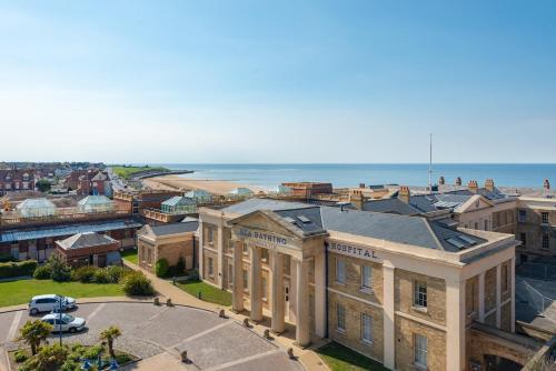 an aerial view of a city with the ocean at The Loft Margate in Margate