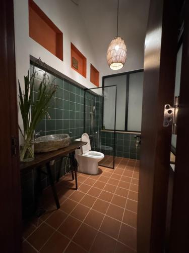 a bathroom with a toilet and a sink at Notre Maison 5 - R07 in Ho Chi Minh City