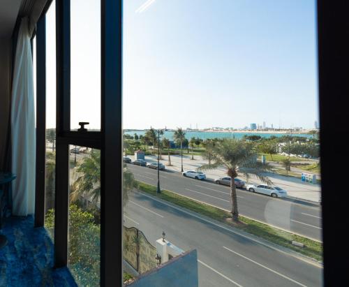 a view from a window of a road with cars at nasim aizraq hotel فندق نسيم ازرق in Jeddah