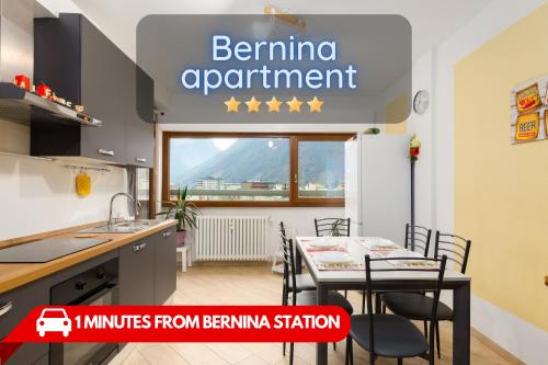 a kitchen with a table and chairs in a room at 1min from Bernina Express - Mountain View - AC - WiFi in Tirano