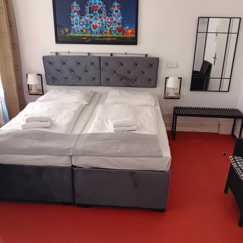 a bedroom with a large bed in a room at Hotel Amelie Berlin in Berlin