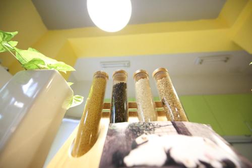 a group of four cricket bats in a wooden box at Huxi B&B in Jian