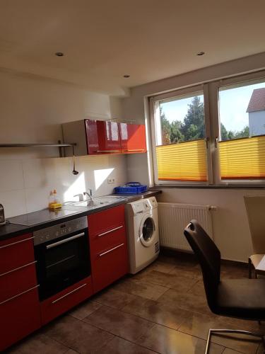 a kitchen with a sink and a washing machine at CASA Del SUR in Braunschweig