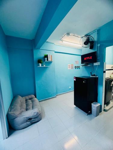 a room with a blue room with a dog bed in it at Affordable 3BR for 8 pax Malaysian guest only Walk to Usm Netflix in Gelugor