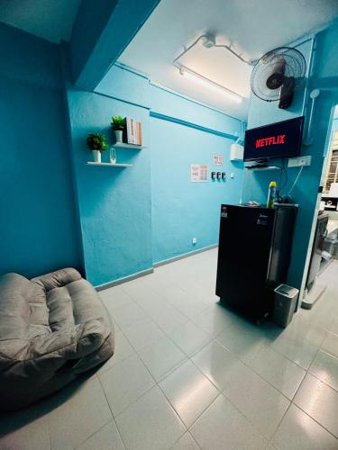a blue room with a dog bed in a room at Affordable 3BR for 8 pax Malaysian guest only Walk to Usm Netflix in Gelugor