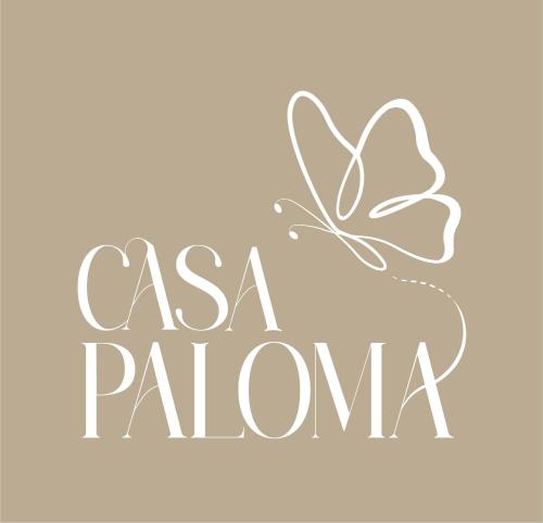 a butterfly sits on the inscription as a palmana at Casa Paloma in Ventimiglia