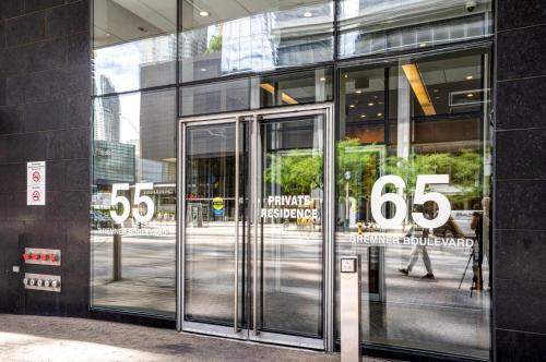 an entrance to a building with a revolving door at Exquisite Living Toronto in Toronto