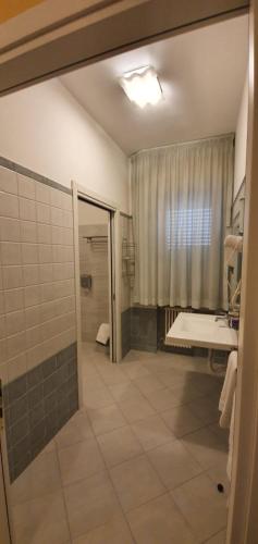 a bathroom with a shower and a sink at La Lanterna in Silvi Marina