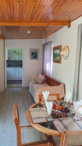a living room with a table and a couch at Armadale Country Retreat in Gqeberha
