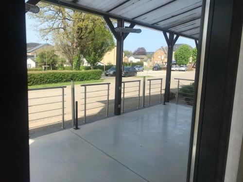 a view from a glass door of a patio at Petite chatelaine in Herbeumont