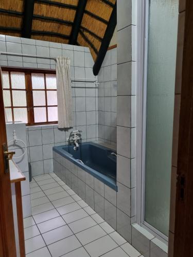 Ένα μπάνιο στο Kudu Crescent Guesthouse