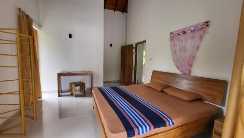 Postel nebo postele na pokoji v ubytování Parrot Paradise Negombo