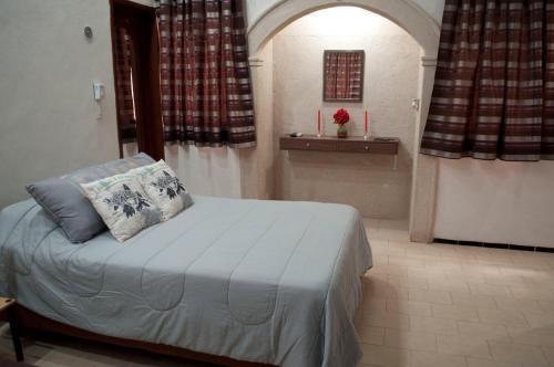 Ένα ή περισσότερα κρεβάτια σε δωμάτιο στο Villa Odalys Cozy Mexican style house