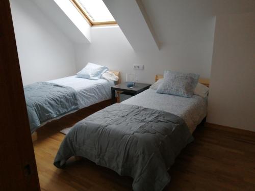 En eller flere senge i et værelse på Ático en Ribeira Ría de Arousa