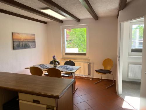 a dining room with a table and chairs at Ferienhaus Hartelt in Ebergötzen