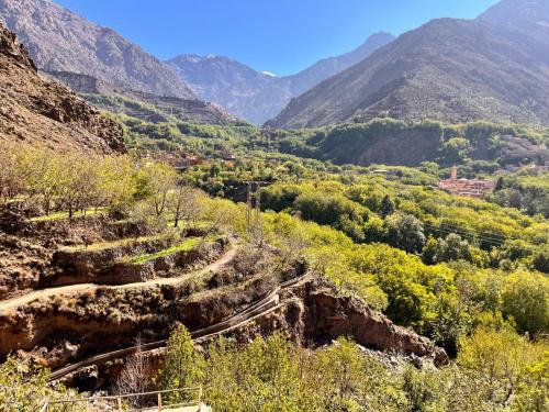 a view of a valley with mountains in the background at Oussaya House in Imlil