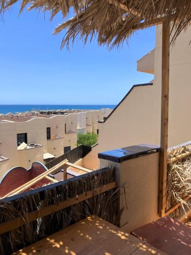 a view from the balcony of a resort with the ocean at Playa de la Fuente in Lajita