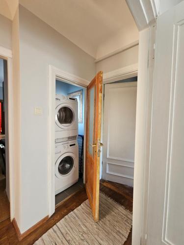 a laundry room with a washer and dryer at White House Apartment in Jūrmala