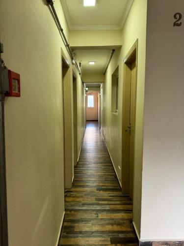an empty corridor in an office building with a long hallway at New Point Hotel in Sao Paulo