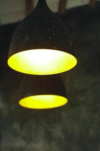 two lights that are hanging from a ceiling at Amazing Villa in Matara