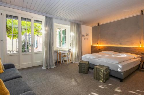 Postel nebo postele na pokoji v ubytování Seven Boutique Hotel