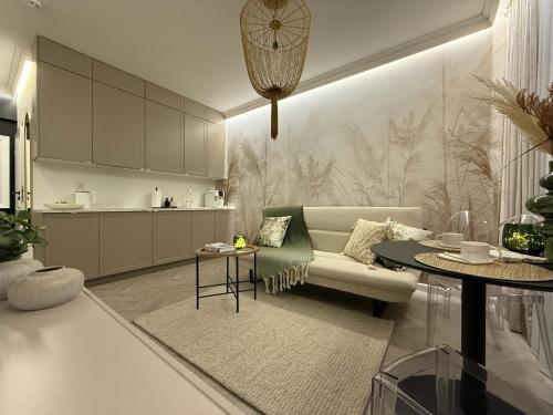a living room with a couch and a table at Apartament Pod Żaglami 4 in Sława