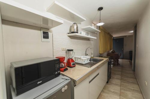 Una cocina o zona de cocina en San Pedro Apartments