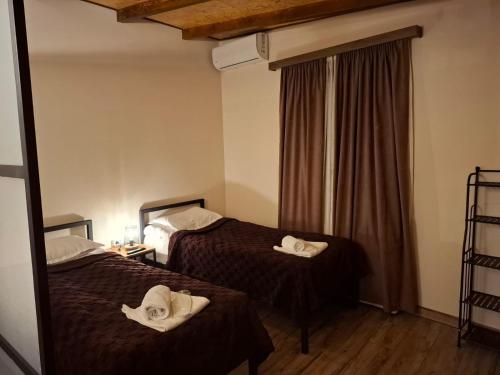 Katil atau katil-katil dalam bilik di Old Town Trinity Apartments