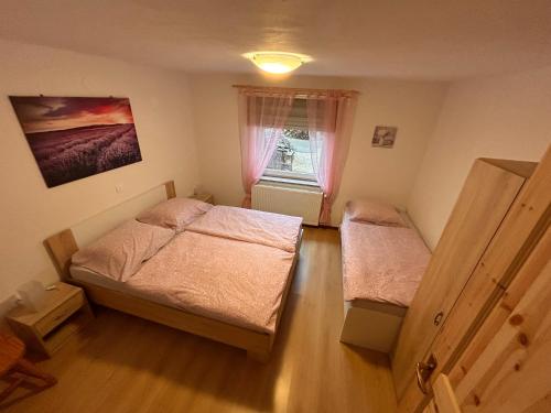 Postel nebo postele na pokoji v ubytování Apartma Brin
