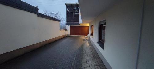 an empty hallway of a building with a brick floor at FeWo Bergenrot Urlaub mit Hund in Arnsberg