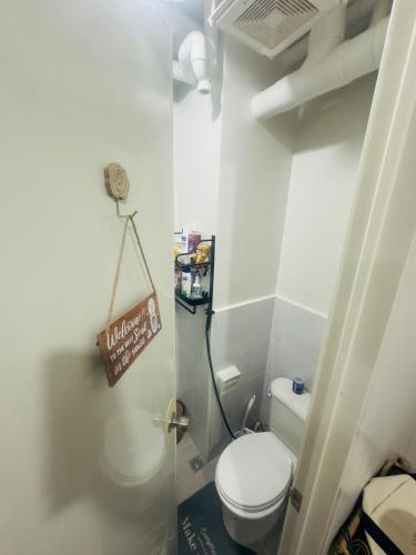 a small bathroom with a toilet in a room at Our House! in Lapu Lapu City