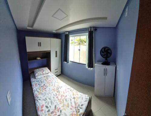Ένα ή περισσότερα κρεβάτια σε δωμάτιο στο Casa 600 mts da praia do Simao Canto dos Ganchos