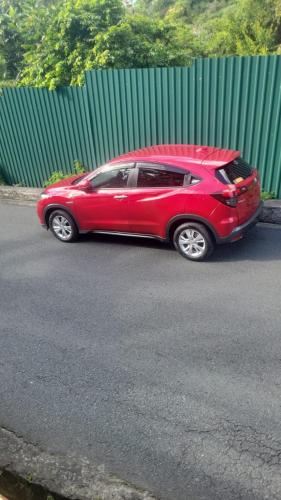 a red car parked on the side of a street at Desired View vacation rentals in LʼIvrogne