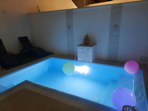 a swimming pool with balloons in a room at VILLA PERLA del SALENTO con piscina in Lido Marini