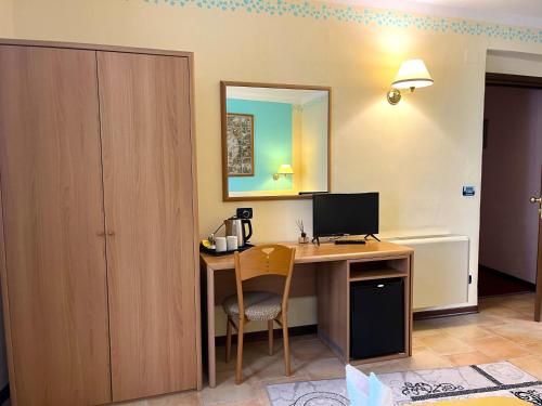 Телевизор и/или развлекательный центр в Hotel Susa